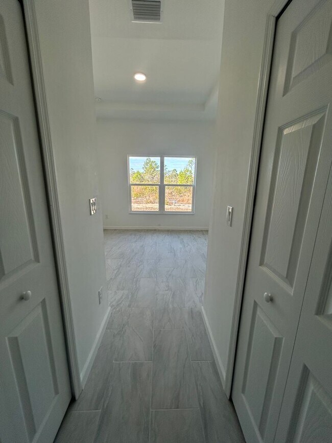 Building Photo - BRAND NEW Modern 4BR/2BA Home with Garage – Peaceful Lake Placid Retreat