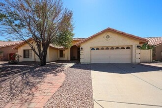 Building Photo - Welcome to this stunning 4-bedroom, 2-bath...