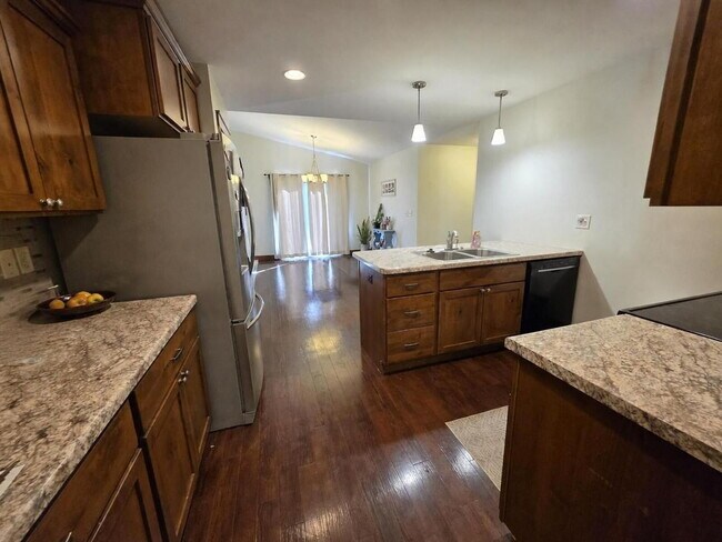 Building Photo - FREE SEPTEMBER RENT for this Spacious 4-Bedroom Home with Vaulted Ceilings with Finished Basement...