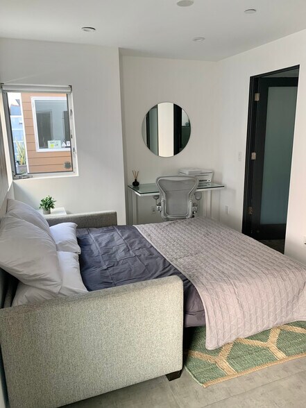 1st Floor guest room / office with a comfortable pull-out sofa. Sliding Barn door & ensuite bathroom - 7197 Formosa Fusion Ct