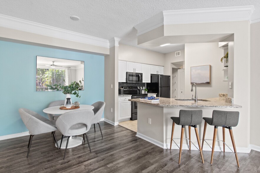 Kitchen and Dining Table at Verona at Boynton Beach Apartments in Boynton Beach, FL 33426 - Verona at Boynton Beach