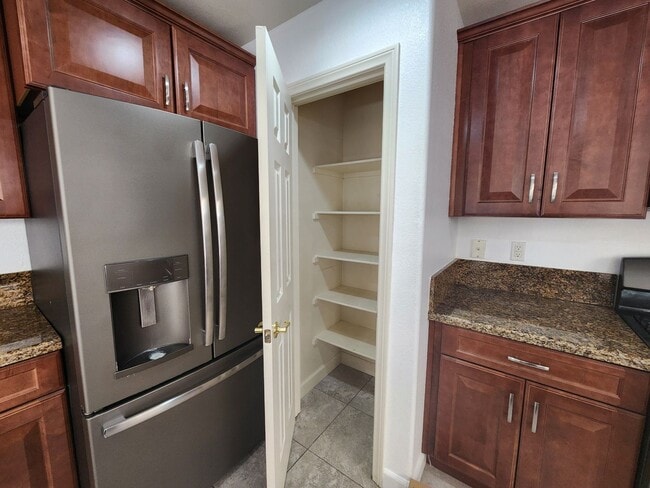 Building Photo - Sleek 2 story home with tile in most living areas and upgraded kitchen.