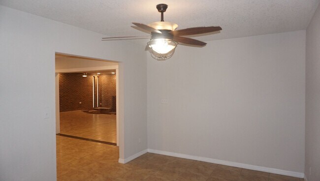 Building Photo - Four Bed - Three Bath - Large Storage Area...