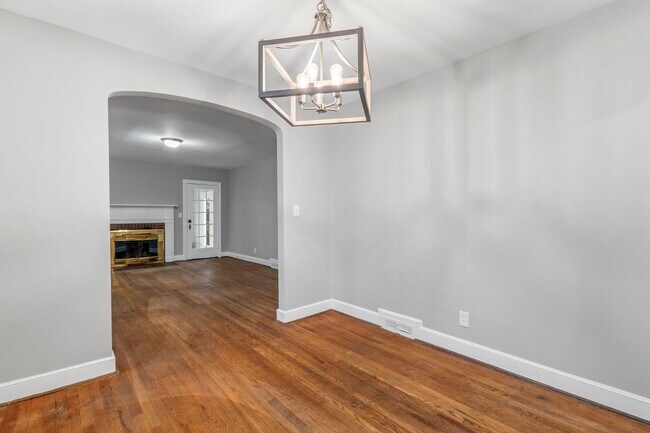 Building Photo - Brick home, Two Story, Hardwoods, DR, 2 Sun Rooms, FP, Carport!.