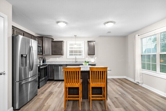 Building Photo - Stocked Pond, Walking Trails and More!!