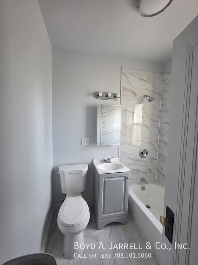 Building Photo - 10855 S Vernon Ave