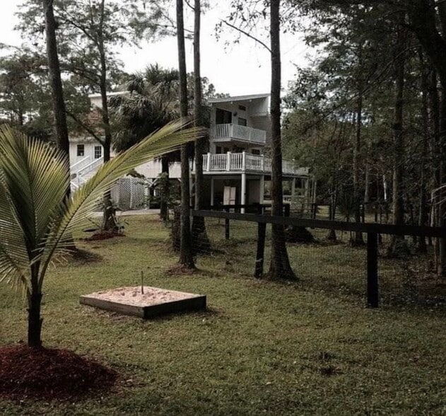 Automatic gate opens into concrete driveway - 17187 Wildwood Rd