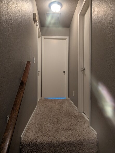 Upstairs hallway to bedrooms and bathroom - 14429 N Pennsylvania Ave