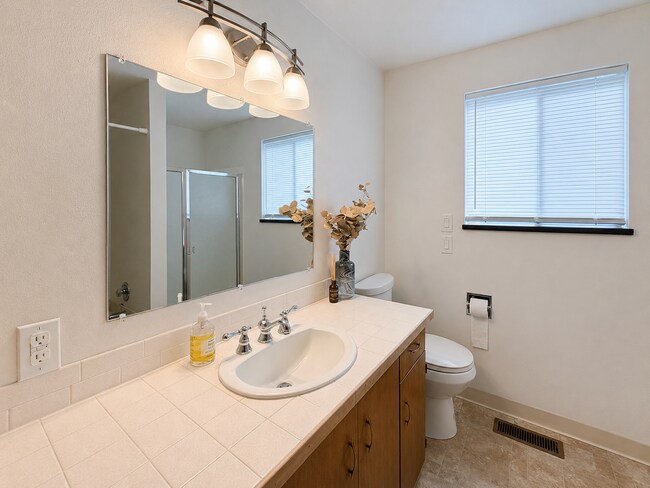 Building Photo - Beautiful Split-Level Home with Fireplace, Deck, Garage, and EV Charger