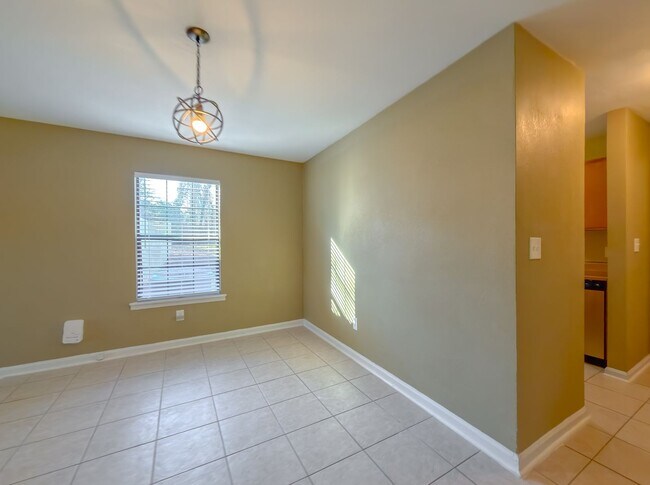 Building Photo - LOVELY & Modern NW 2/1 w/ New Flooring & Huge Privacy Fenced Yard that Inc Lawn Maintenance! Avai...