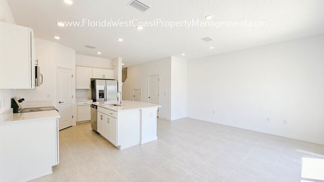 Building Photo - OUTSTANDING BRAND NEW TOWNHOME! SKYE RANCH...
