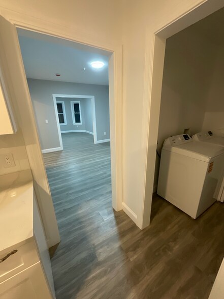 Kitchen looking into laundry Room, Dining Room and Living Room - 52 Woolson St