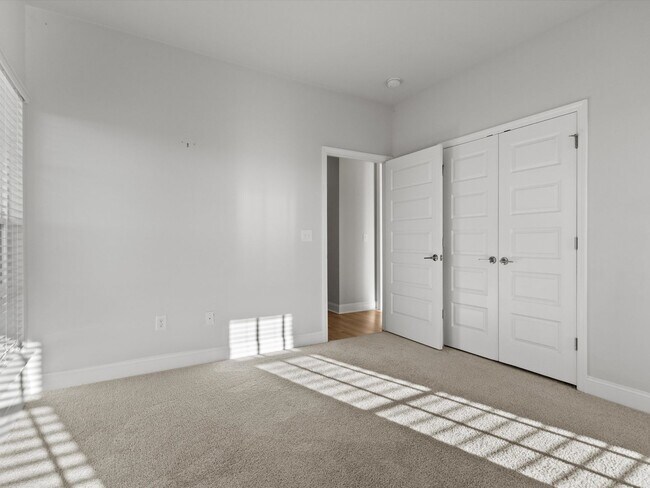 Building Photo - 3 Car Garage! Modern end-unit townhome located in the desirable Clift Farm!