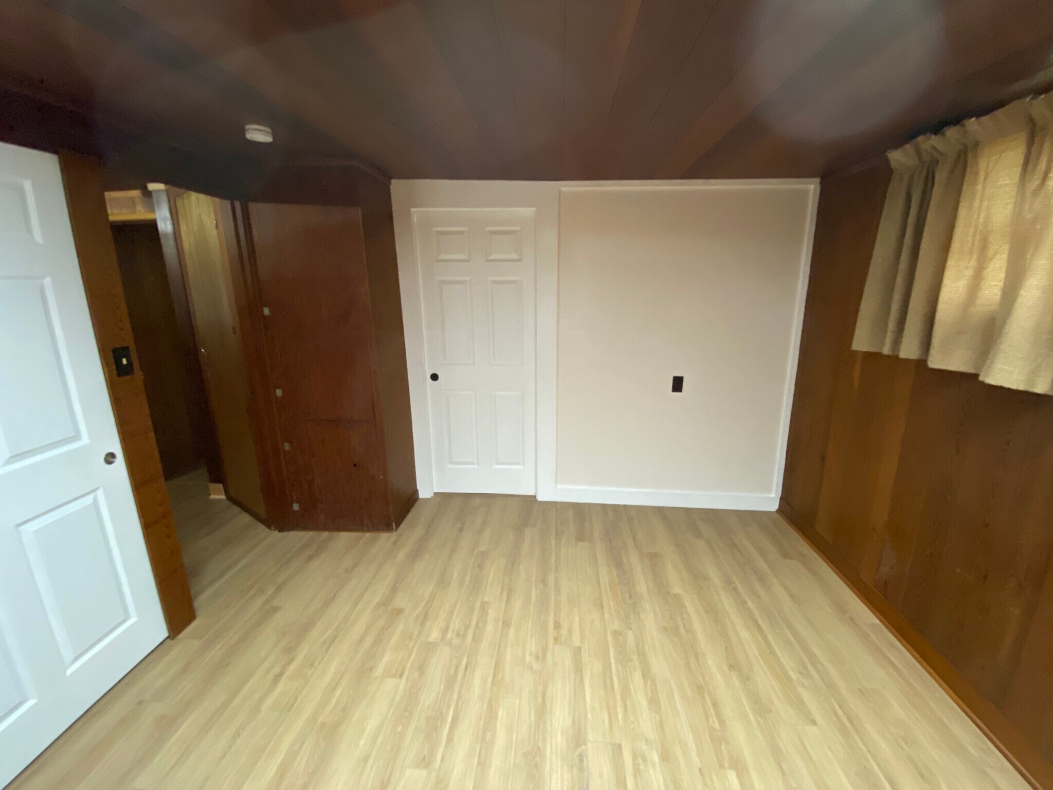 Bedroom 1 with door to living room closed and door to mudroom open - 1816 Co Rd 432