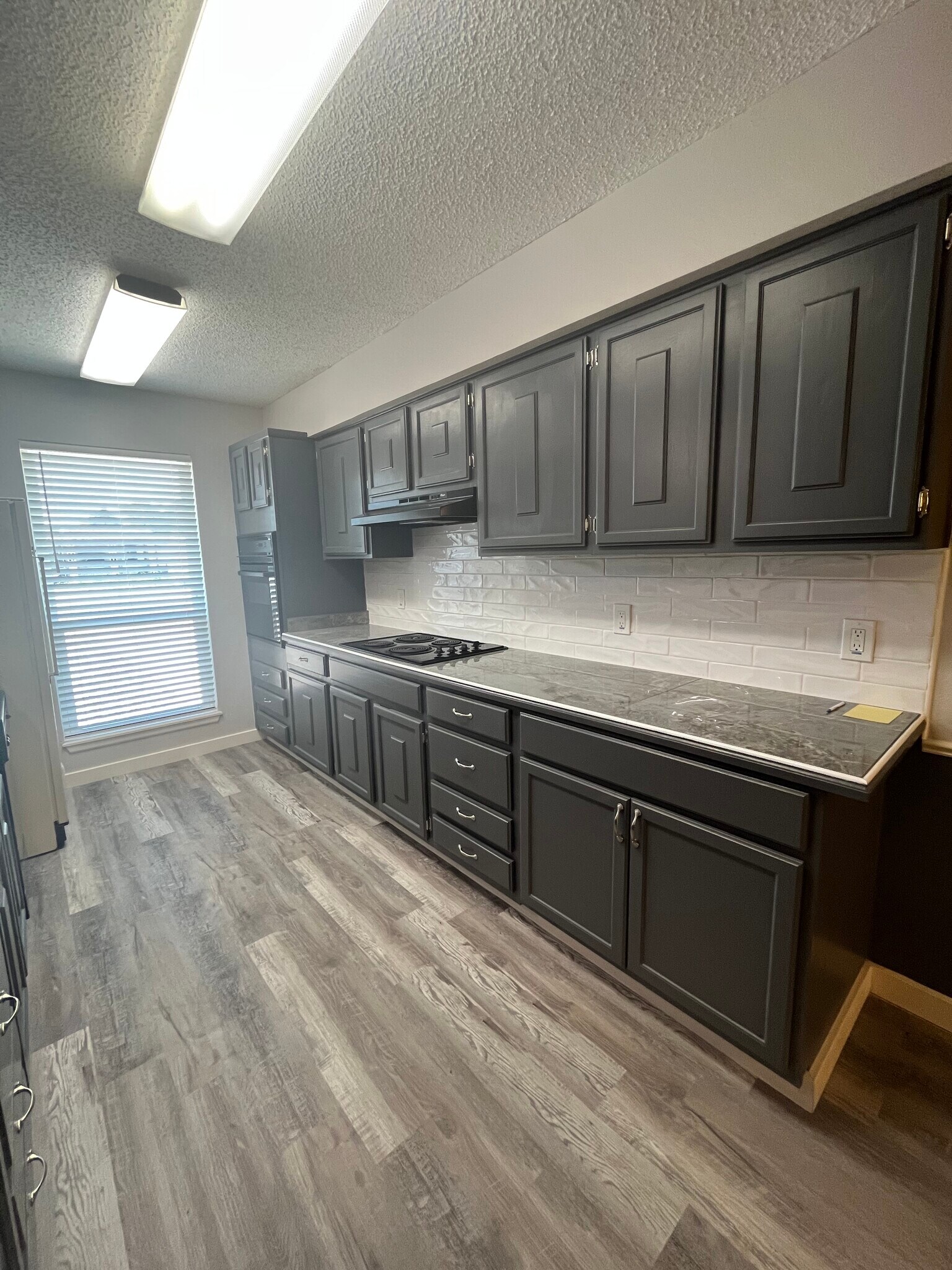 Kitchen with built in oven, cooktop, vent a hood, refrigerator, dishwasher and disposer - 6160 Denis Ln