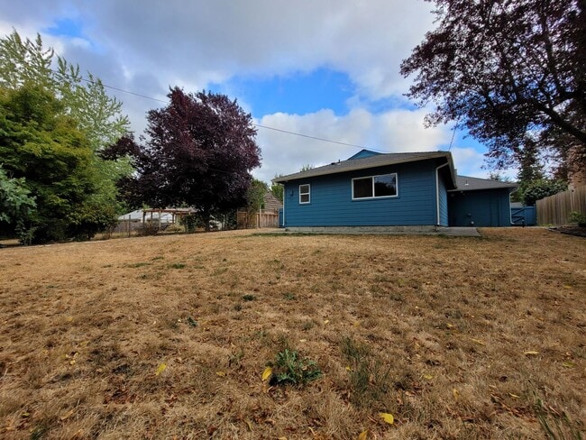 Building Photo - Bright Four-Bedroom Home with Spacious Outdoor Area
