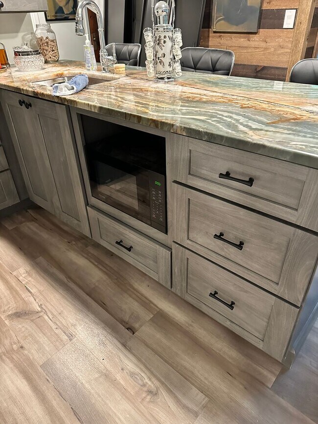 Building Photo - Dream Home in Highland, Michigan: Your Private Oasis on 5 Wooded Acres