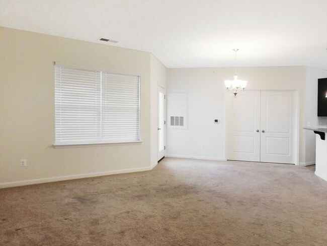 Building Photo - Pet Friendly Condo with Deck and 1 Car Garage