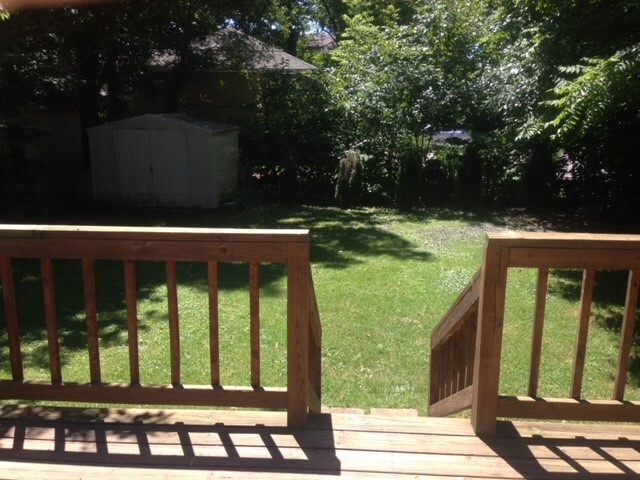 Deck to fenced backyard and storage shed. - 206 E Vermilya Ave