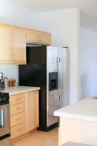 Kitchen with maple cabinets and stainless steel appliances - 15458 SW Mallard Dr