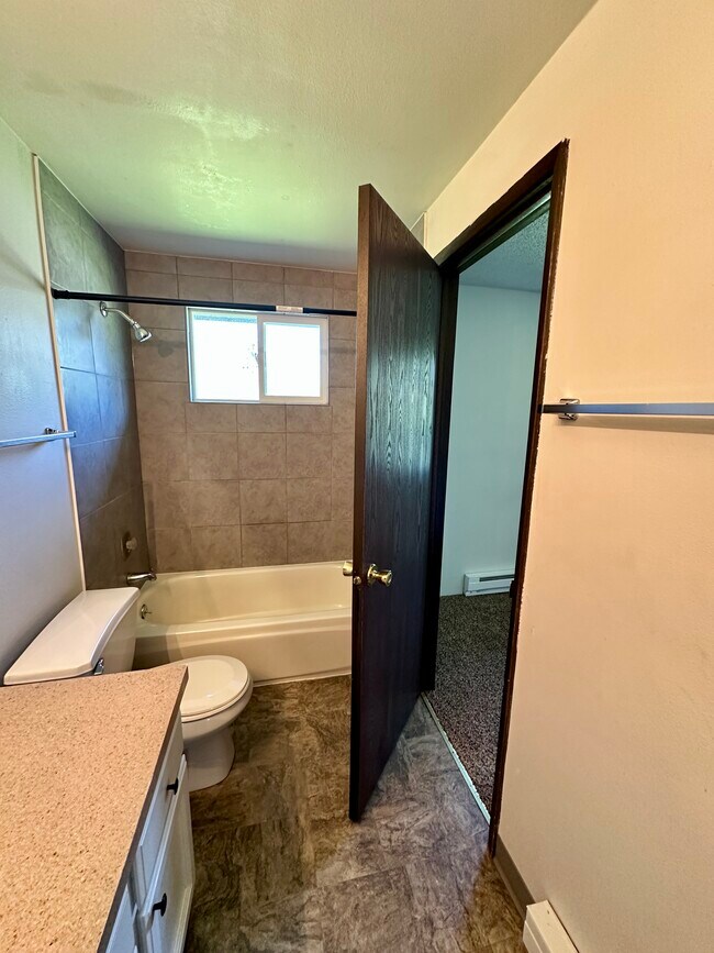 Upstairs bathroom with connecting door - 13409 E 8th Ave