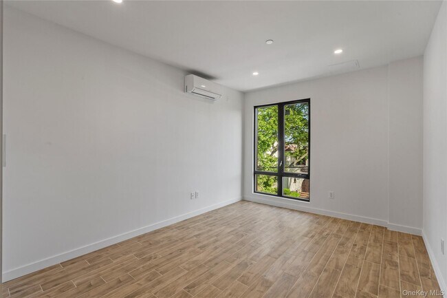 Building Photo - 213-41 38th Ave