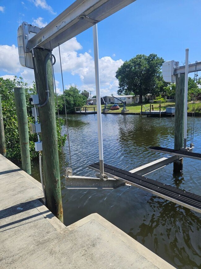 Building Photo - Port Charlotte Waterfront With Salt Water Pool