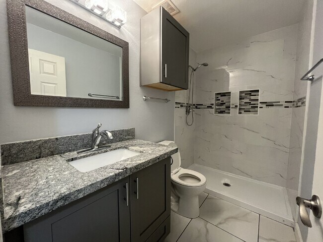 Building Photo - "Charming 4-Bed Oasis with Granite Touch & a Beautiful Pool"