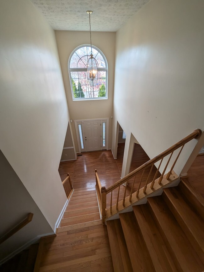 Stairway to foyer - 12124 Burning Ridge Ct