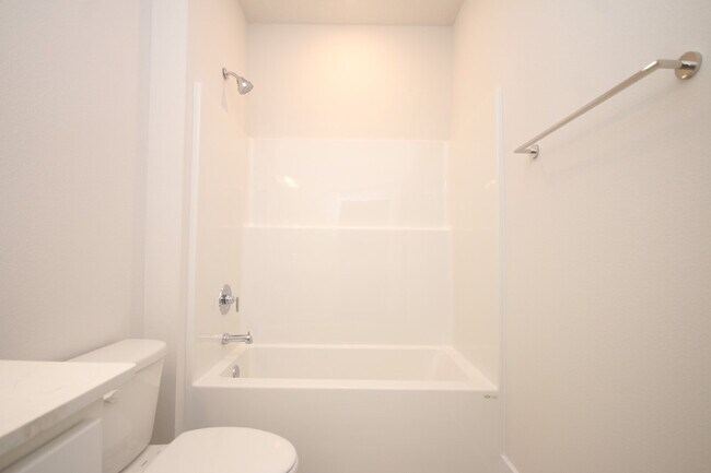 Building Photo - Don’t Miss This 4BR Avalon Home — Modern Interior, Open Floor Plan & Access to Pool, Volleyball &...