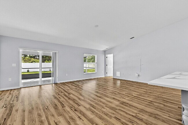 Building Photo - Modern 4-Bedroom, 3-Bath Home with Private In-Law Suite – Palm Coast, FL
