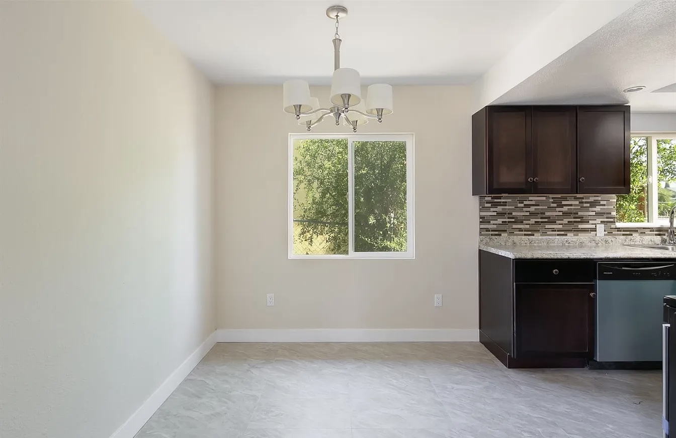 Kitchen comes with a fridge and stove included. - 649 N K St