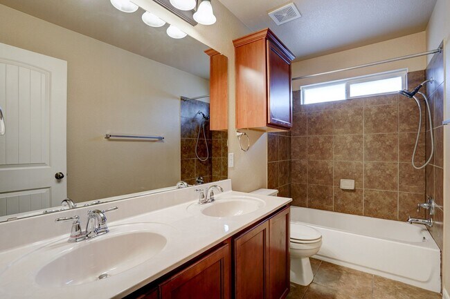 Building Photo - Bright & Roomy 4BR • 2.5BA • Two-Level Living