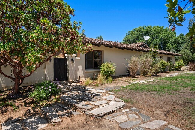 Building Photo - This Beautiful Hacienda Style Home combine...
