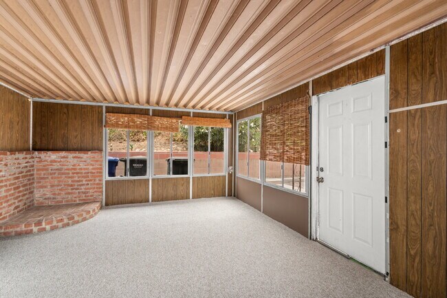 Building Photo - Charming Updated Home With Drive-Through Garage Access