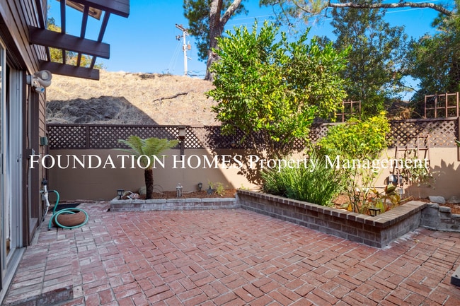 Building Photo - Bright & Tranquil End Unit!  A/C! Parking! Community Pool! FOUNDATION