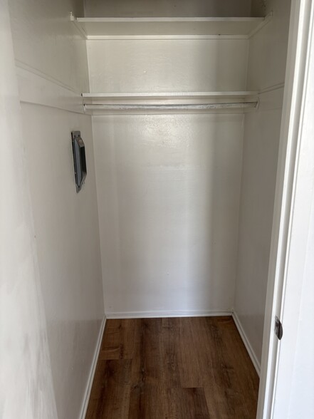 Bedroom with wall in closet and hardwood floors - 3044 Market St