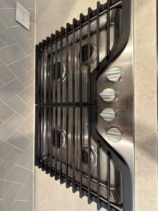 Building Photo - Four bed two bath on a corner lot with a pool in Sunfield. Gas cook top, double ovens. Open kitch...