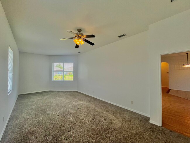 Building Photo - Spacious 4-Bed, 3-Bath Home in Guard-Gated...