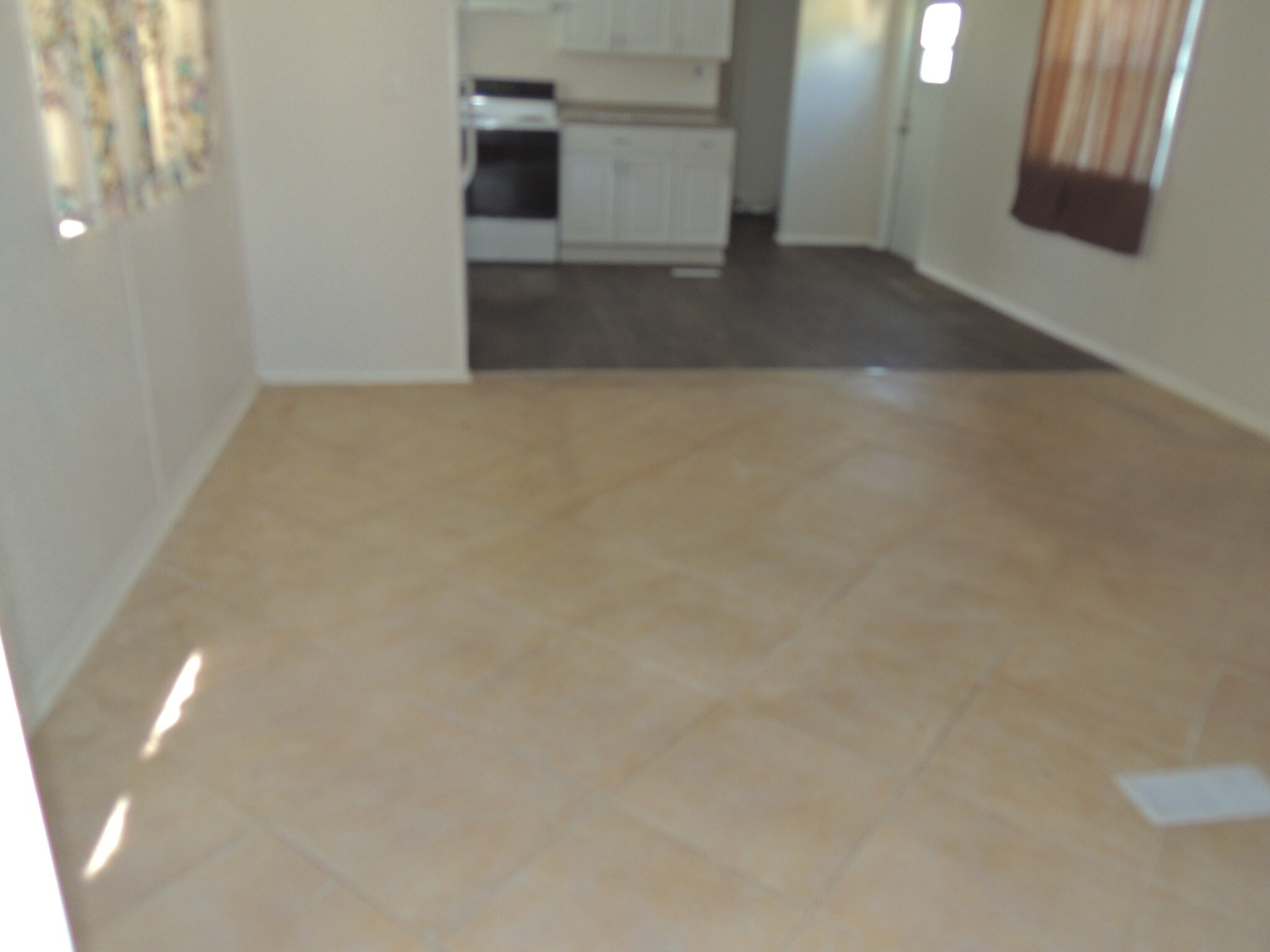 TILE FLOOR IN LIVING ROOM - 7815 Sunrunner Dr