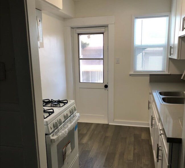 Galley Style Kitchen with Back Door - 9343 Lomita Dr