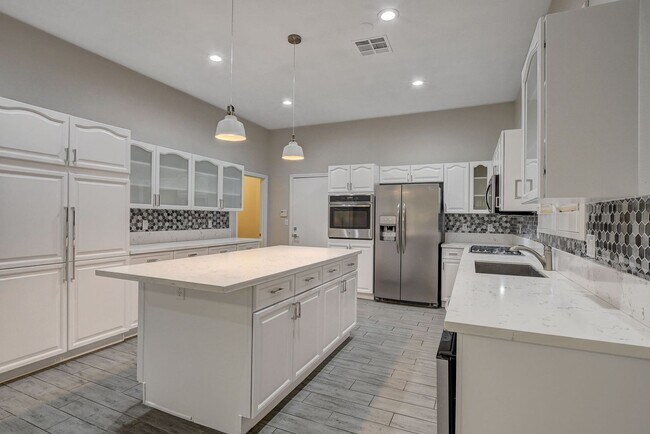 Building Photo - 4 bedroom, 3-bath home with a Pool!