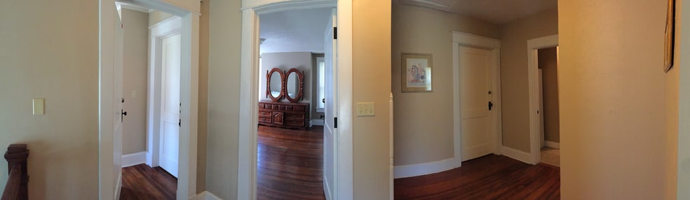 This panorama shows the three doors to bedrooms (left to right: NE, SE, and SW) and the bathroom door (on the far right). The one being advertised here is the SE bedroom. - 1525 South 7th Street