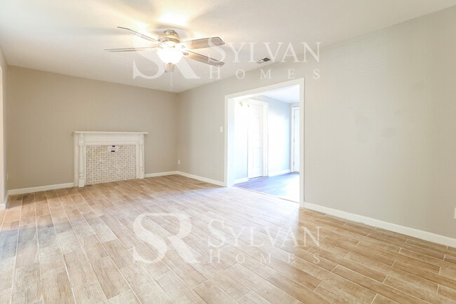 Building Photo - Venture outside to the expansive backyard,...