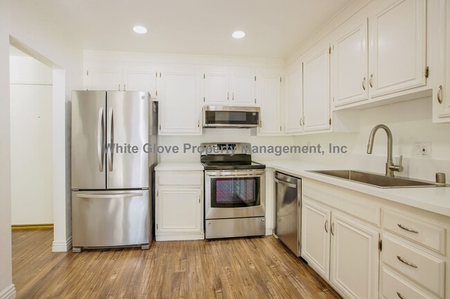 Building Photo - Updated Newport Beach Condo in Gated Versailles Community with Resort-Style Amenities