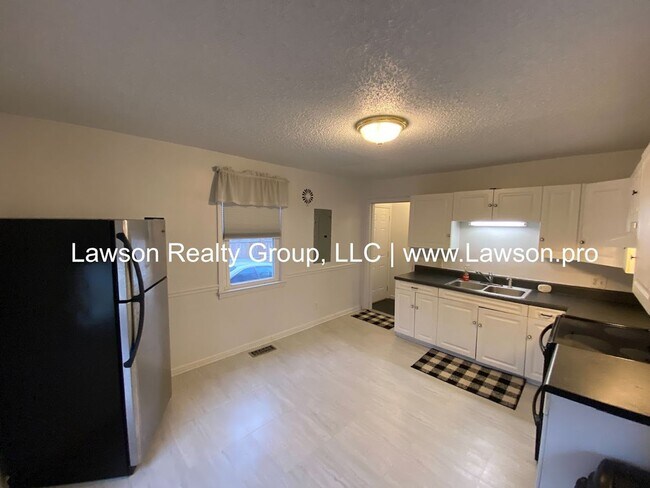 Building Photo - Well Maintained Three Bedroom with Fenced Yard and Shed