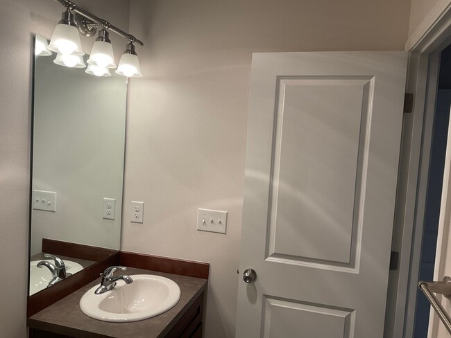 Building Photo - Riverfront Townhome with Tandem Garage & Fenced Yard