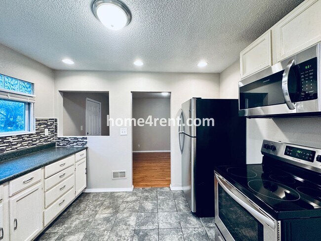 Building Photo - Adorable Home Featuring Wood Floors, SS Ap...