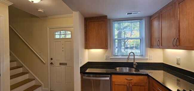 Building Photo - Spacious 2-bedroom townhouse on beautifully landscaped grounds.