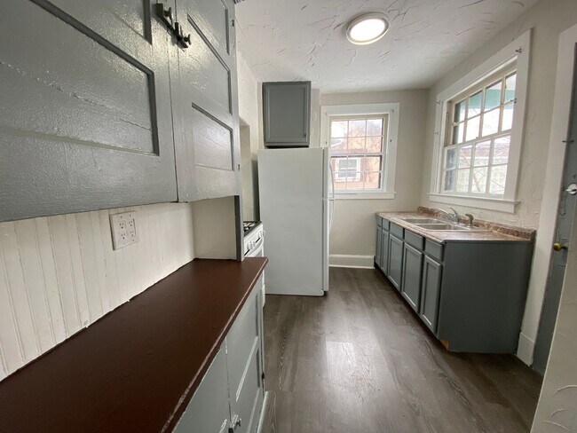 Building Photo - Cozy Akron Home w/ Fireplace Charm, Detached Garage & Back Porch